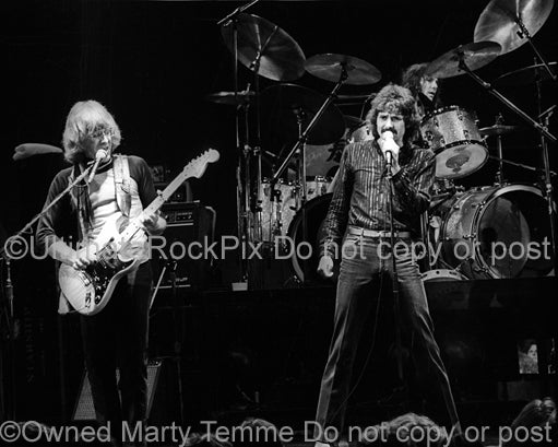 Photo of Paul Kantner, Mickey Thomas and Aynsley Dunbar of Jefferson Starship in concert in 1980 by Marty Temme