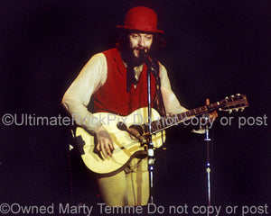 Photo of Ian Anderson of Jethro Tull playing guitar in 1976 by Marty Temme