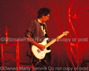 Photos of Guitarist Keith Richards of The Rolling Stones Playing a Music Man guitar in Concert in 1989 by Marty Temme