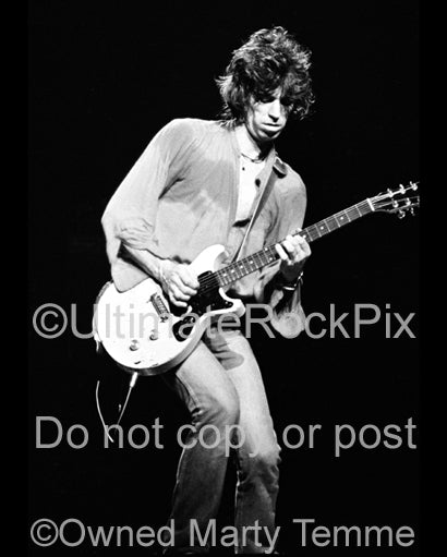 Black and white photo of Keith Richards playing a Les Paul Junior in concert in 1979 by Marty Temme