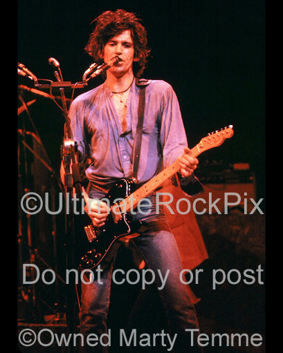 Photo of Keith Richards of The New Barbarians playing a Telecaster Deluxe in concert in 1979 by Marty Temme