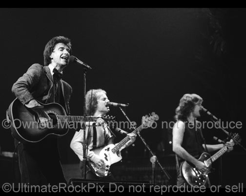 Photo of Ray Davies, Dave Davies and Jim Rodford of The Kinks in 1979 by Marty Temme