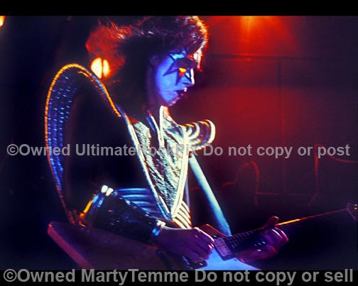 Photos of Ace Frehley of Kiss playing a Gibson Explorer in concert in the 1970's by Marty Temme