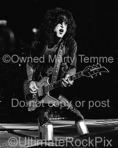 Black and white photo of Paul Stanley of Kiss in concert in 2000 by Marty Temme