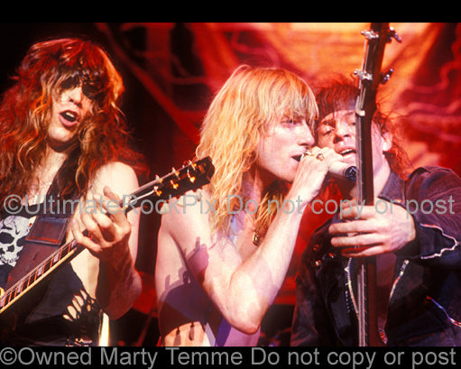 Photo of Ronnie Younkins, Steve Whiteman and Donnie Purnell of Kix in concert in 1989 by Marty Temme
