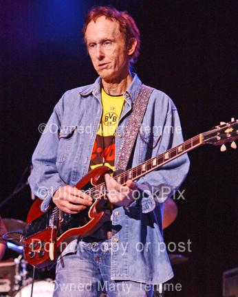 Photo of guitar player Robby Krieger of The Doors playing his Gibson SG onstage by Marty Temme