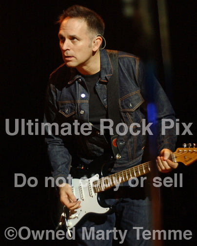 Photo of guitar player Keith Scott of Bryan Adams in concert by Marty Temme