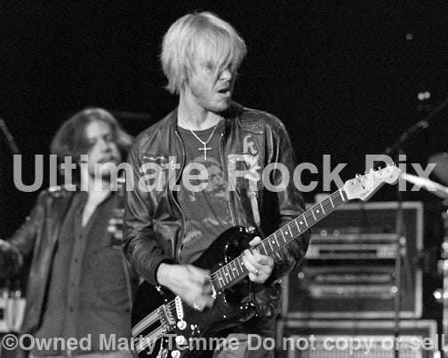 Black and white photo of Kenny Wayne Shepherd playing a Stratocaster onstage by Marty Temme