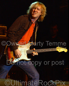 Photo of Kenny Wayne Shepherd playing a sunburst Stratocaster in concert by Marty Temme