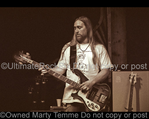 Sepia tint photo of bassist Scott Reeder of Kyuss in concert in 1994 by Marty Temme