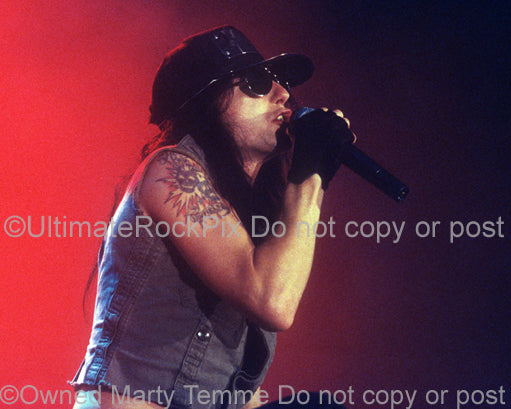 Photo of Phil Lewis of L.A. Guns in concert in 1991 by Marty Temme