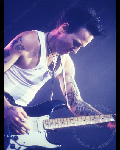 Photo of guitar player Tracii Guns of L.A. Guns in concert in 1991 by Marty Temme
