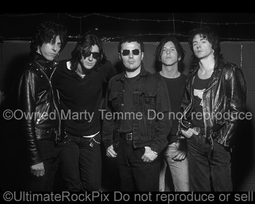 Black and white photo of Phil Lewis, Tracii Guns, Steve Riley, Kelly Nickels and Mick Cripps of L.A. Guns during a photo shoot in 1995 by Marty Temme