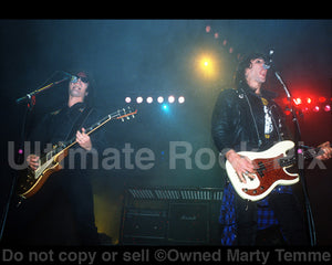 Photo of Mick Cripps and Kelly Nickels of L.A. Guns in concert in 1991 by Marty Temme