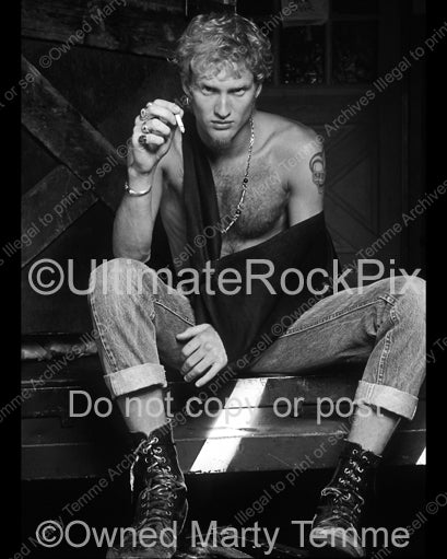 Black and white photo of Layne Staley smoking a cigarette during a photo shoot in 1991 in Hollywood, California by Marty Temme