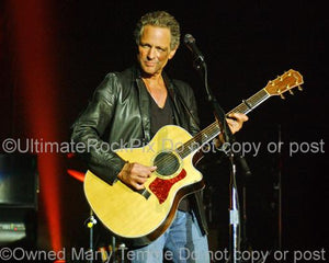 Photos of Guitarist Lindsey Buckingham of Fleetwood Mac Playing a Taylor Acoustic Guitar in Concert
