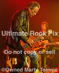 Photo of Lindsey Buckingham of Fleetwood Mac playing a Rick Turner guitar in concert in by Marty Temme