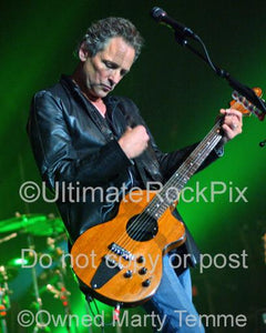 Photo of Lindsey Buckingham of Fleetwood Mac playing a Rick Turner guitar in concert in by Marty Temme