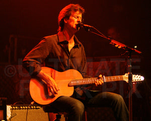Photo of Neale Heywood of Fleetwood Mac playing guitar in concert by Marty Temme