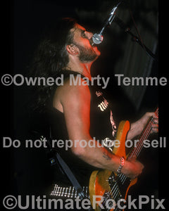 Photo of Lemmy Kilmister of Motorhead in concert in 1990 by Marty Temme