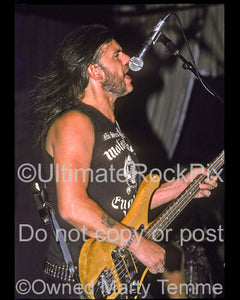 Photo of Lemmy Kilmister of Motorhead performing onstage in 1990 by Marty Temme