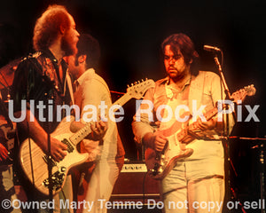Photo of Lowell George and Paul Barrere of Little Feat in concert in 1978 by Marty Temme