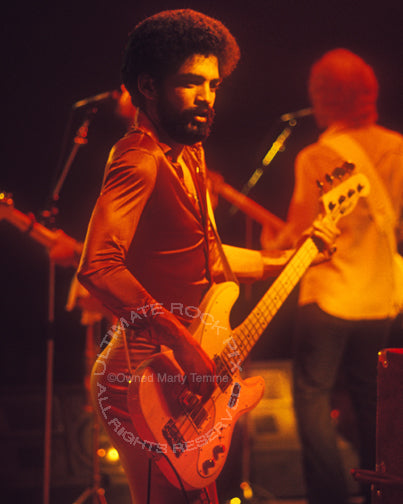 Photo of bassist Kenny Gradney of Little Feat in concert in 1977 by Marty Temme