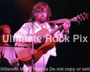 Photo of Lowell George of Little Feat playing a Gibson acoustic in concert in 1977 by Marty Temme