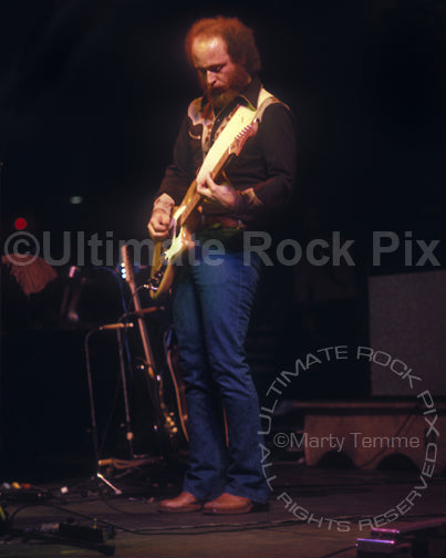 Photo of Paul Barrere of Little Feat playing a Music Man StingRay guitar in 1977 by Marty Temme