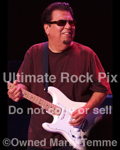 Photo of guitarist Cesar Rojas of Los Lobos in concert