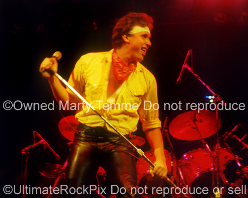 Photo of singer Mike Reno of Loverboy in concert in 1981 by Marty Temme