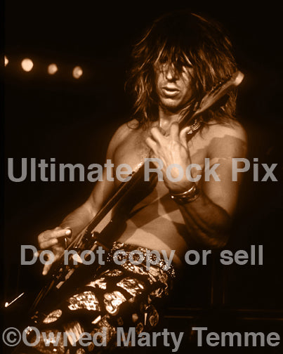 Black and white sepia tint photo of George Lynch of Lynch Mob in concert in 1991 by Marty Temme