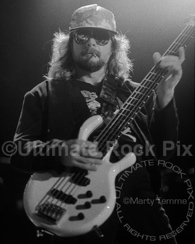 Black and white photo of Leon Wilkeson of Lynyrd Skynyrd in concert in 1991 by Marty Temme