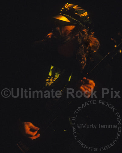 Photo of bassist Leon Wilkeson of Lynyrd Skynyrd in concert in 1991 by Marty Temme