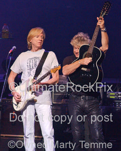 Photo of Justin Hayward and John Lodge of The Moody Blues performing onstage by Marty Temme
