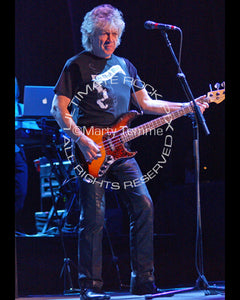 Photo of John Lodge of The Moody Blues playing bass in concert by Marty Temme