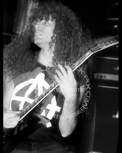 Photo of guitarist Marty Friedman of Megadeth in concert in 1990 by Marty Temme
