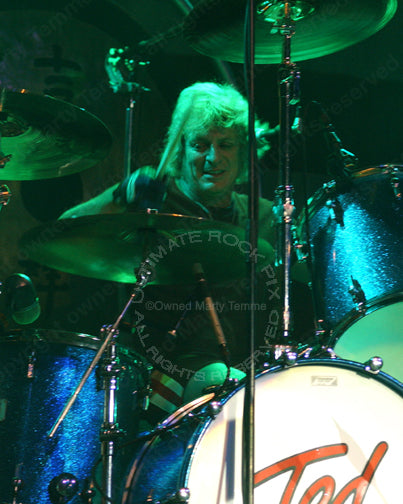 Photo of drummer Mick Brown of Ted Nugent and Dokken in concert by Marty Temme