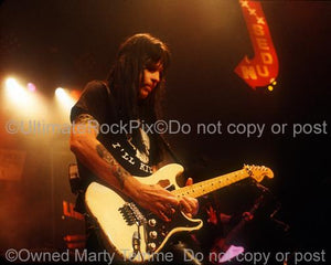 Photos of Guitar Player Mick Mars of Motley Crue Playing a Fender Stratocaster in Concert by Marty Temme