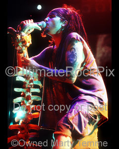 Photo of Al Jourgensen of Ministry singing in concert in 1992 by Marty Temme