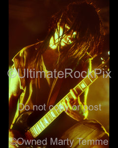 Photo of Al Jourgensen of Ministry playing a Gibson SG in concert in 1992 by Marty Temme