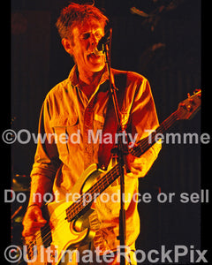 Photo of bassist Bones Hillman of Midnight Oil in concert by Marty Temme