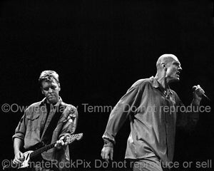 Photo of Martin Rotsey and Peter Garrett of Midnight Oil in concert by Marty Temme