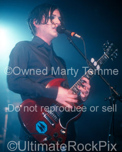 Photo of guitar player Brian Molko of the band Placebo in concert by Marty Temme