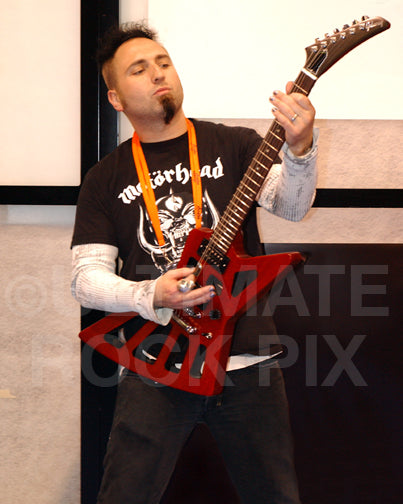 Photo of Monte Pittman of Prong and Ministry playing guitar