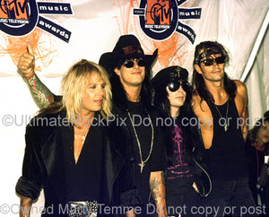 Photo of Vince Neil, Nikki Sixx, Mick Mars and Tommy Lee of Motley Crue by Marty Temme