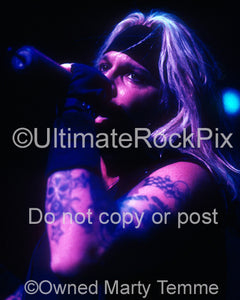 Photo of singer Vince Neil of Motley Crue in concert in 2000 by Marty Temme