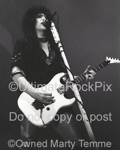 Black and white photo of Mick Mars of Motley Crue in concert in 1985 by Marty Temme