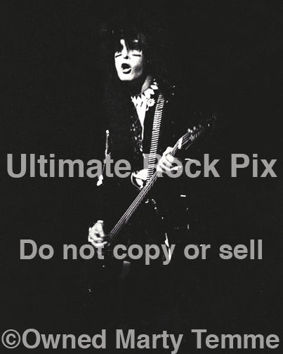Black and white photo of Nikki Sixx of Motley Crue in concert in 1985 by Marty Temme