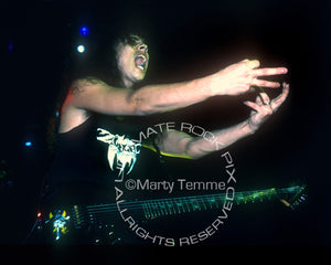 Photo of Kirk Hammett of Metallica playing an ESP guitar in concert in 1989 by Marty Temme